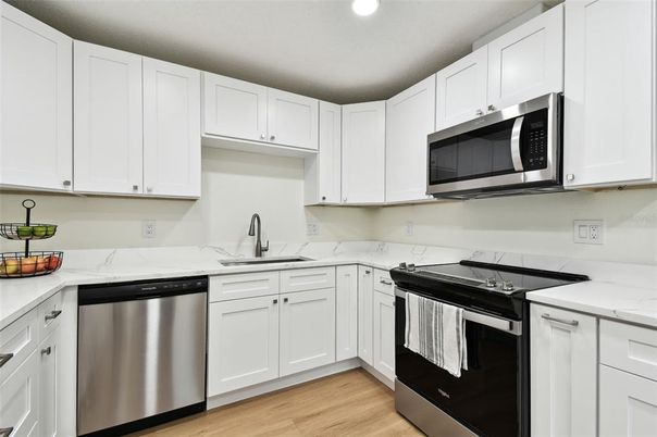 Interior, Kitchen, Recessed Lighting, Stainless Steel Appliances, Wood Texture Flooring