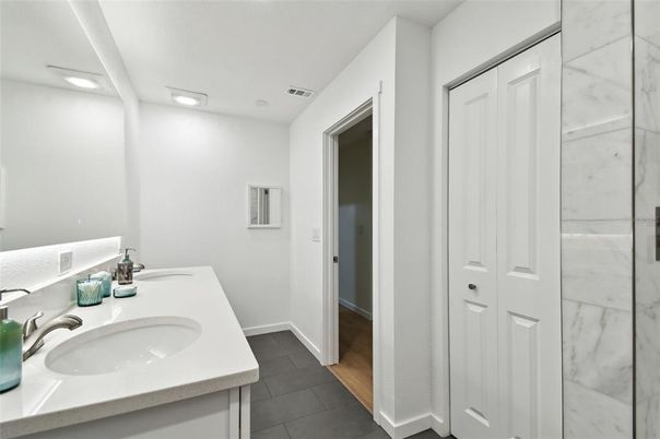 Bathroom, Dual Sink Vanities, Interior, Marble Walls, Recessed Lighting