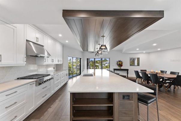 Dining room, Interior, Kitchen, Pendant Lights, Recessed Lighting, Stainless Steel Appliances, Wood Texture Flooring