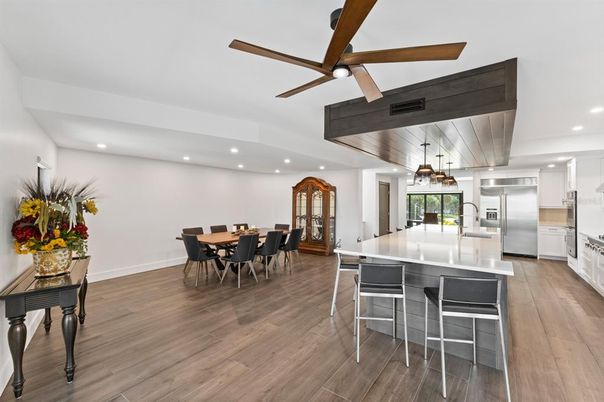 Chandelier, Dining room, Interior, Kitchen, Pendant Lights, Recessed Lighting, Stainless Steel Appliances, Wood Texture Flooring