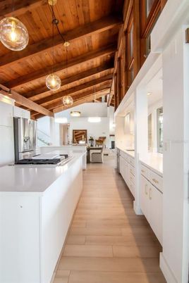 Fireplace, Interior, Kitchen, Living room, Pendant Lights, Stainless Steel Appliances, Wooden Beams, Wooden Ceilings, Wood Texture Flooring