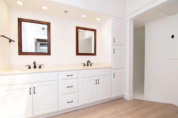 Bathroom, Dual Sink Vanities, Interior, Recessed Lighting, Wood Texture Flooring