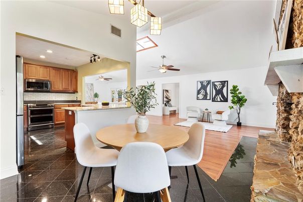 Dining room, Fireplace, Interior, Kitchen, Recessed Lighting, Stainless Steel Appliances, Wood Texture Flooring