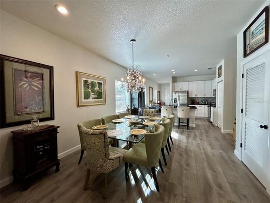 Chandelier, Dining room, Interior, Kitchen, Recessed Lighting, Stainless Steel Appliances, Wood Texture Flooring