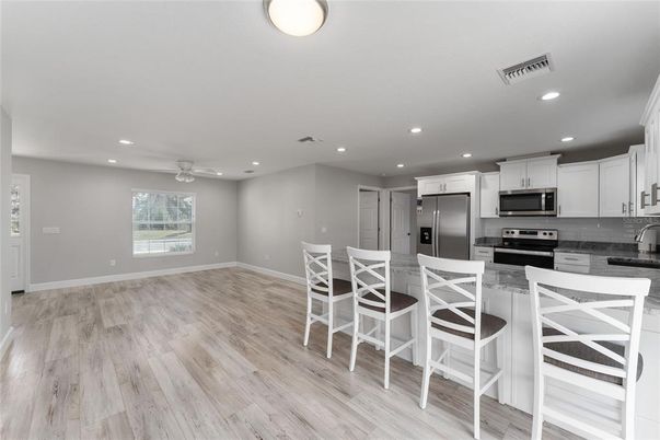 Interior, Kitchen, Recessed Lighting, Stainless Steel Appliances, Wood Texture Flooring