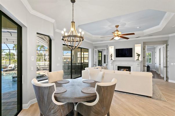 Chandelier, Dining room, Fireplace, Interior, Living room, Pendant Lights, Wood Texture Flooring