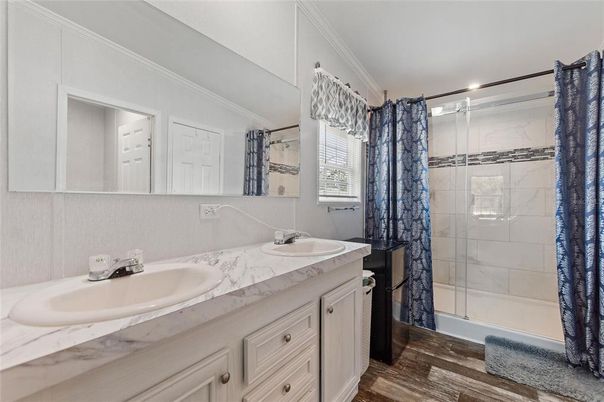 Bathroom, Dual Sink Vanities, Glass Shower, Interior, Marble Walls, Wood Texture Flooring