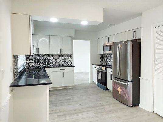 Interior, Kitchen, Recessed Lighting, Stainless Steel Appliances, Wood Texture Flooring
