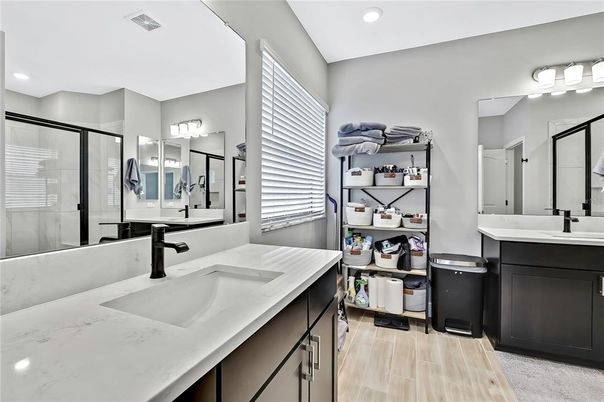 Bathroom, Dual Sink Vanities, Glass Shower, Interior, Recessed Lighting, Wood Texture Flooring