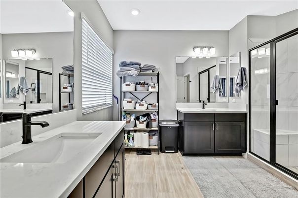 Bathroom, Dual Sink Vanities, Glass Shower, Interior, Recessed Lighting, Wood Texture Flooring