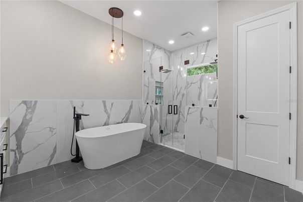 Bathroom, Free Standing Baths, Glass Shower, Interior, Marble Walls, Pendant Lights, Recessed Lighting