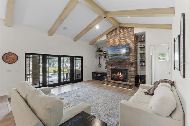 Fireplace, Interior, Living room, Recessed Lighting, Stone Walls, Wooden Beams, Wood Texture Flooring