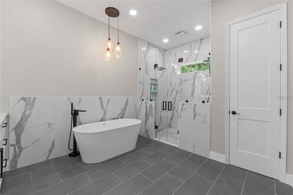 Bathroom, Free Standing Baths, Glass Shower, Interior, Marble Walls, Pendant Lights, Recessed Lighting