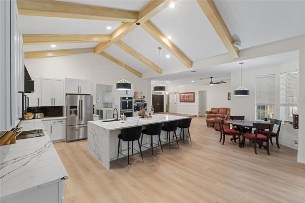 Dining room, Interior, Kitchen, Pendant Lights, Recessed Lighting, Stainless Steel Appliances, Wooden Beams, Wood Texture Flooring