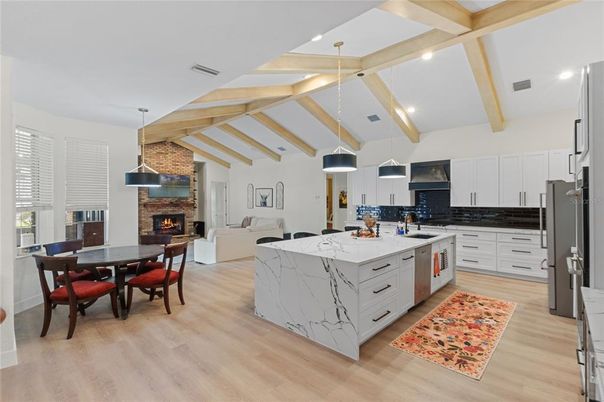 Dining room, Fireplace, Interior, Kitchen, Living room, Pendant Lights, Recessed Lighting, Stainless Steel Appliances, Wooden Beams, Wood Texture Flooring