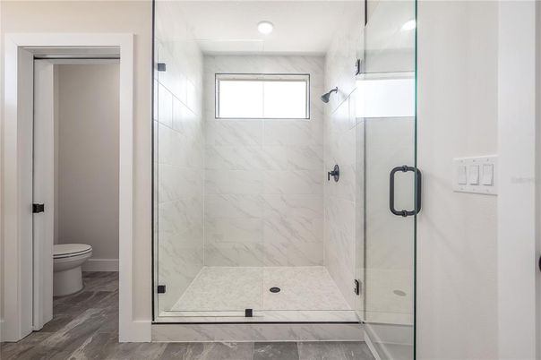 Bathroom, Glass Shower, Interior, Marble Walls, Wood Texture Flooring