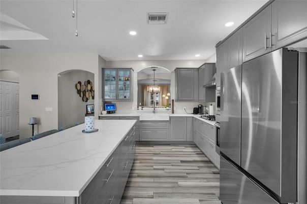 Chandelier, Interior, Kitchen, Pendant Lights, Recessed Lighting, Stainless Steel Appliances, Wood Texture Flooring