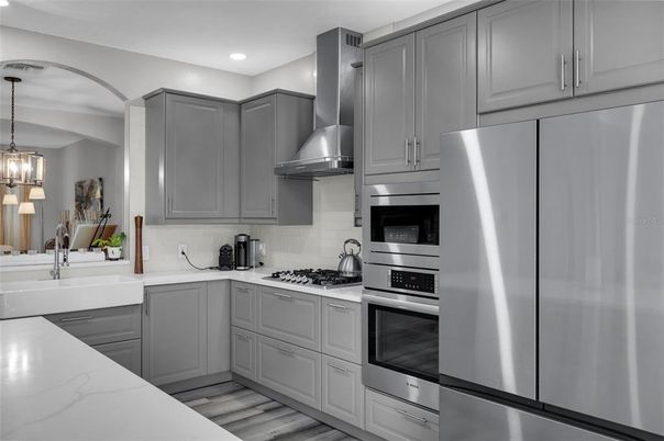 Interior, Kitchen, Pendant Lights, Recessed Lighting, Stainless Steel Appliances, Wood Texture Flooring