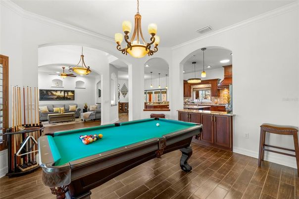 Billiard Table, Chandelier, Game Room, Interior, Pendant Lights, Recessed Lighting, Wood Texture Flooring