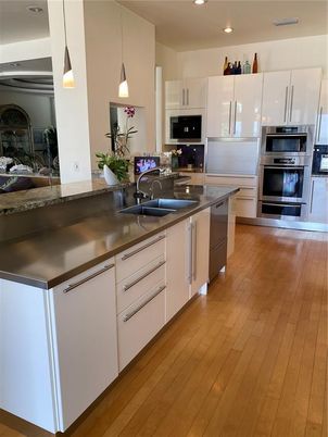 Interior, Kitchen, Pendant Lights, Recessed Lighting, Stainless Steel Appliances, Wood Texture Flooring
