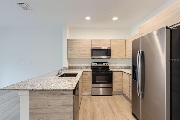 Interior, Kitchen, Recessed Lighting, Stainless Steel Appliances, Wood Texture Flooring