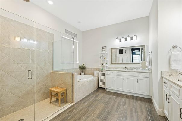 Bathroom, Dual Sink Vanities, Glass Shower, Interior, Recessed Lighting, Wood Texture Flooring