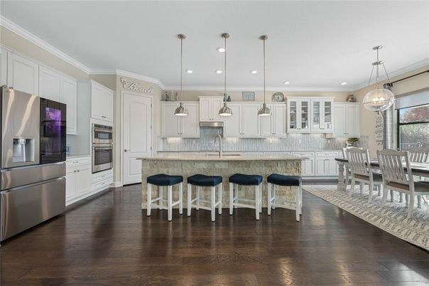 Dining room, Interior, Kitchen, Pendant Lights, Recessed Lighting, Stainless Steel Appliances, Wood Texture Flooring