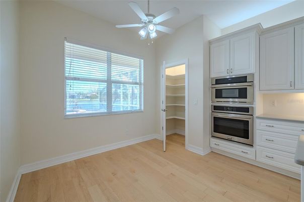 Empty room, Interior, Kitchen, Stainless Steel Appliances, Wood Texture Flooring