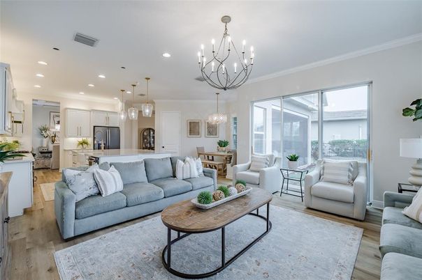 Chandelier, Dining room, Interior, Kitchen, Living room, Pendant Lights, Recessed Lighting, Stainless Steel Appliances, Wood Texture Flooring