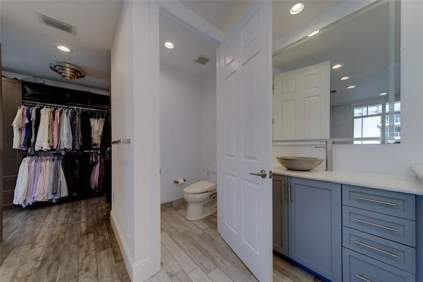 Bathroom, Dual Sink Vanities, Interior, Recessed Lighting, Walk-in Closets, Wood Texture Flooring