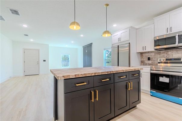 Interior, Kitchen, Pendant Lights, Recessed Lighting, Stainless Steel Appliances, Wood Texture Flooring