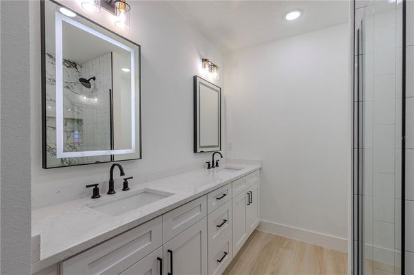 Bathroom, Dual Sink Vanities, Interior, Recessed Lighting, Wood Texture Flooring
