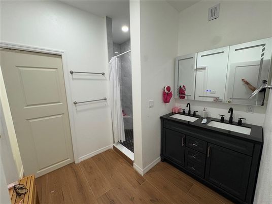 Bathroom, Dual Sink Vanities, Interior, Recessed Lighting, Wood Texture Flooring