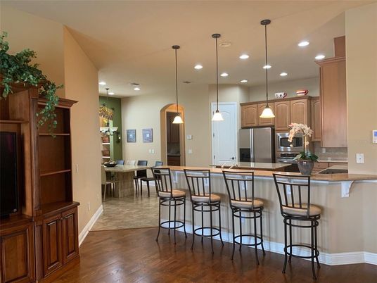 Dining room, Interior, Kitchen, Pendant Lights, Recessed Lighting, Stainless Steel Appliances, Wood Texture Flooring