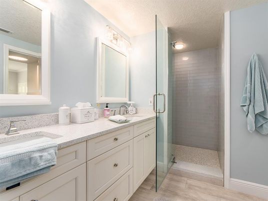 Bathroom, Dual Sink Vanities, Glass Shower, Interior, Wood Texture Flooring