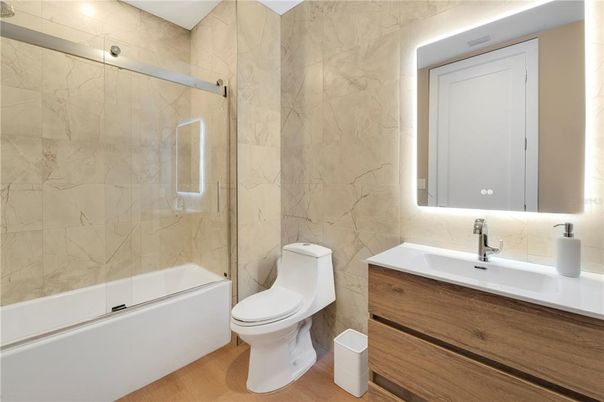 Bathroom, Glass Shower, Interior, Marble Walls, Wood Texture Flooring