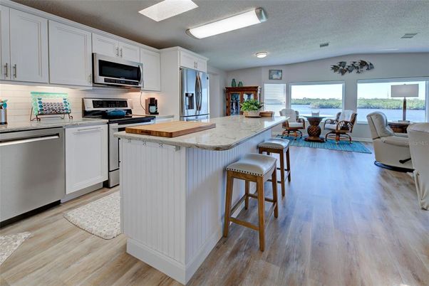 Dining room, Interior, Kitchen, Living room, Recessed Lighting, Stainless Steel Appliances, Wood Texture Flooring