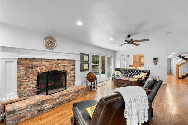 Fireplace, Interior, Living room, Recessed Lighting, Stone Walls, Wood Texture Flooring