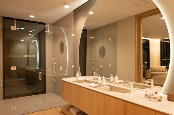 Bathroom, Dual Sink Vanities, Glass Shower, Interior, Recessed Lighting, Wood Texture Flooring
