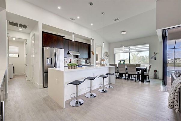 Dining room, Interior, Kitchen, Pendant Lights, Recessed Lighting, Stainless Steel Appliances, Wood Texture Flooring