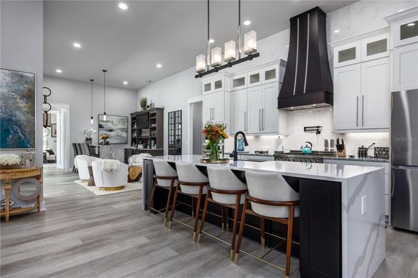Dining room, Interior, Kitchen, Pendant Lights, Recessed Lighting, Stainless Steel Appliances, Wood Texture Flooring