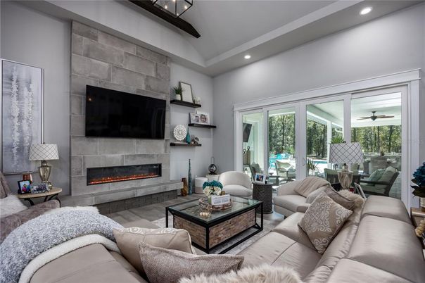 Fireplace, Interior, Living room, Recessed Lighting, Stone Walls, Wood Texture Flooring