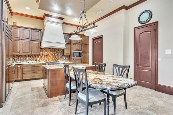 Chandelier, Dining room, Interior, Kitchen, Pendant Lights, Recessed Lighting, Stainless Steel Appliances