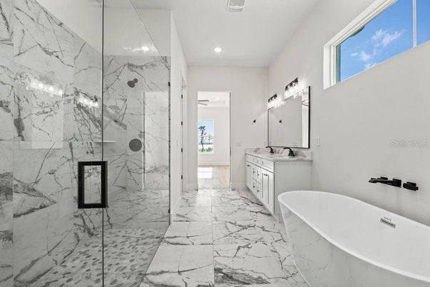 Bathroom, Dual Sink Vanities, Free Standing Baths, Glass Shower, Interior, Marble, Marble Walls, Recessed Lighting