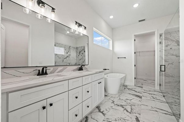 Bathroom, Dual Sink Vanities, Free Standing Baths, Glass Shower, Interior, Marble, Marble Walls, Recessed Lighting