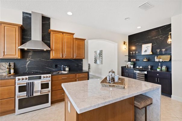 Interior, Kitchen, Marble Walls, Recessed Lighting, Stainless Steel Appliances