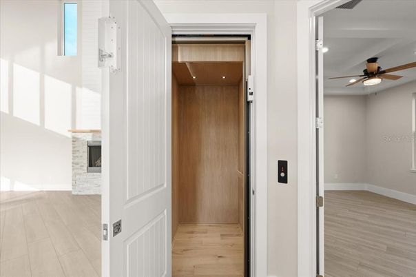 Elevator, Interior, Recessed Lighting, Wooden Ceilings, Wood Texture Flooring, Wooden Walls