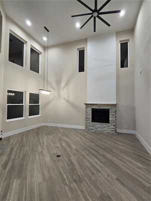Empty room, Fireplace, Interior, Pendant Lights, Recessed Lighting, Wood Texture Flooring