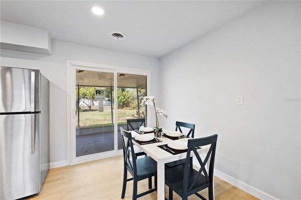 Dining room, Interior, Recessed Lighting, Stainless Steel Appliances, Wood Texture Flooring