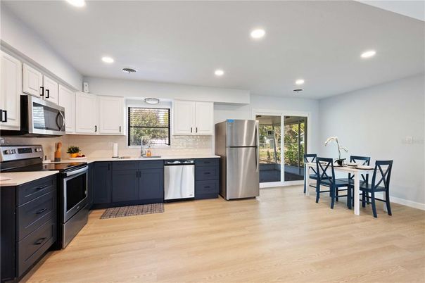 Dining room, Interior, Kitchen, Recessed Lighting, Stainless Steel Appliances, Wood Texture Flooring